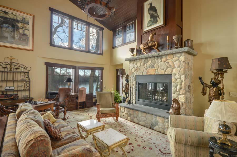 351 Huckins Neck Road Centerville, MA 02632 - Photo 30 of 55 a living room with furniture and a fireplace