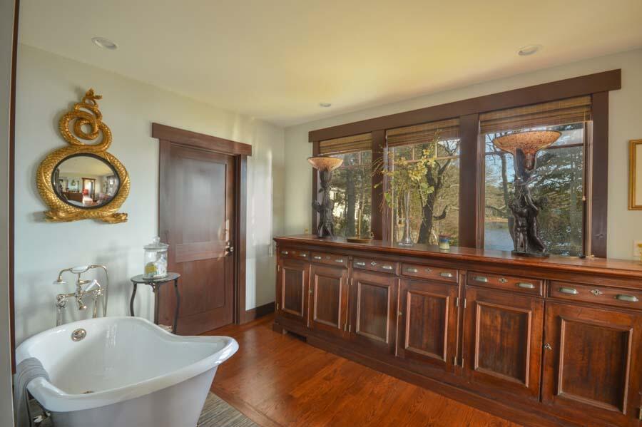 351 Huckins Neck Road Centerville, MA 02632 - Photo 35 of 55 a bathroom with a sink and a large mirror