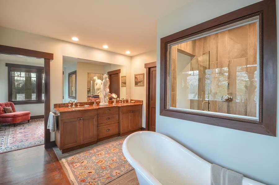 351 Huckins Neck Road Centerville, MA 02632 - Photo 36 of 55 a large bathroom with a large tub and sink