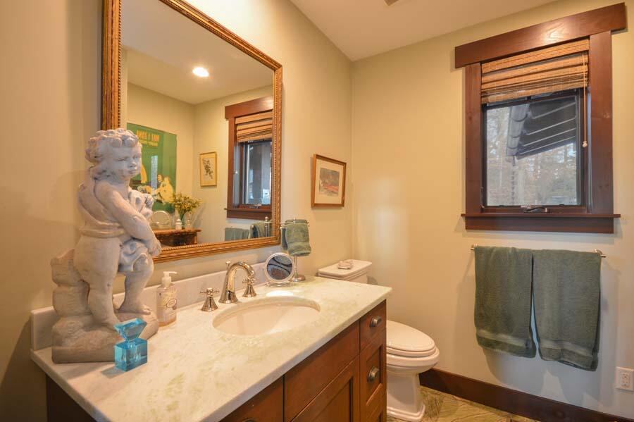 351 Huckins Neck Road Centerville, MA 02632 - Photo 37 of 55 a bathroom with a granite countertop sink a toilet and mirror
