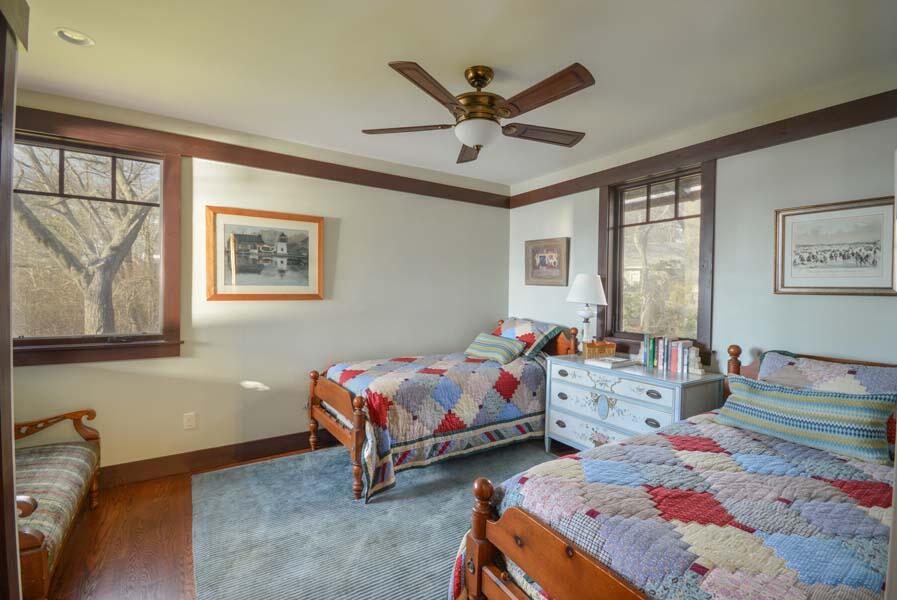 351 Huckins Neck Road Centerville, MA 02632 - Photo 38 of 55 a bedroom with two beds and a window