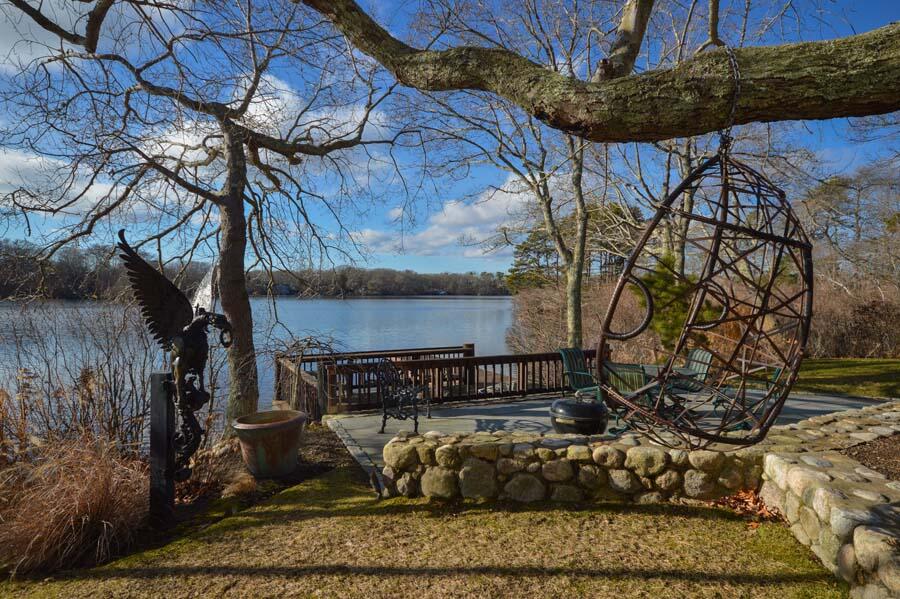 351 Huckins Neck Road Centerville, MA 02632 - Photo 42 of 55 a front view of a house with a yard