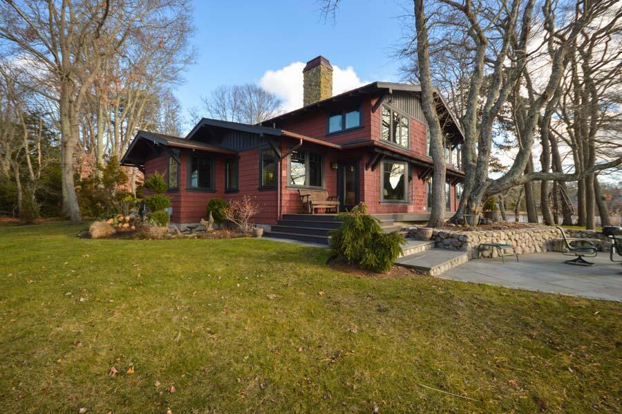 351 Huckins Neck Road Centerville, MA 02632 - Photo 47 of 55 a view of a house with a yard patio and fire pit
