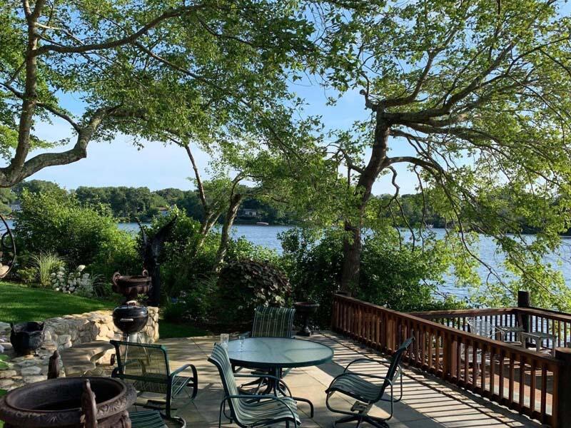 351 Huckins Neck Road Centerville, MA 02632 - Photo 50 of 55 a view of a table and chairs in patio
