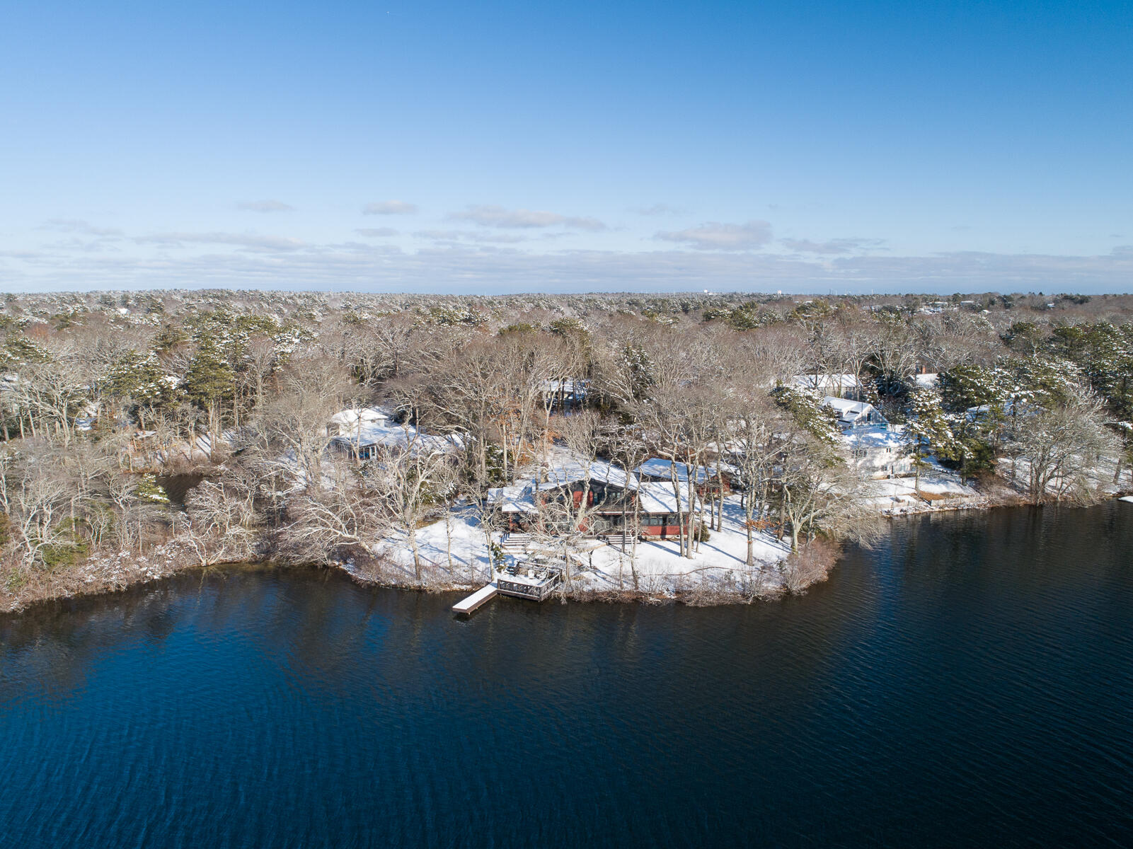 351 Huckins Neck Road Centerville, MA 02632 - Photo 7 of 55 an aerial view of a city with lots of residential buildings and lake in background