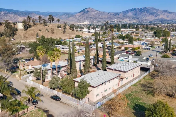 an aerial view of residential houses and outdoor space