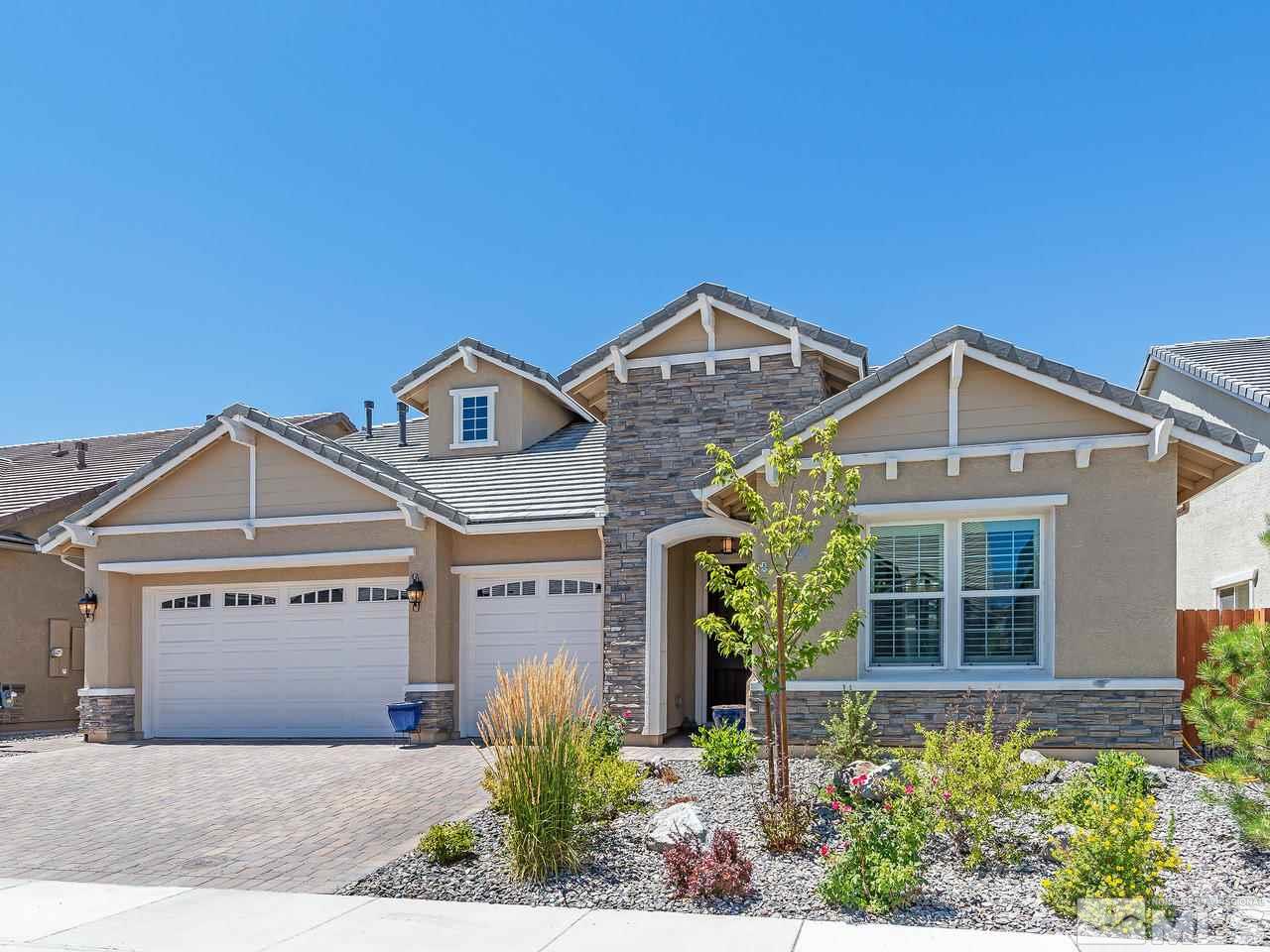 9455 Baldacci Road Reno, NV 89521 - Photo 1 of 22 a front view of a house with a yard and garage