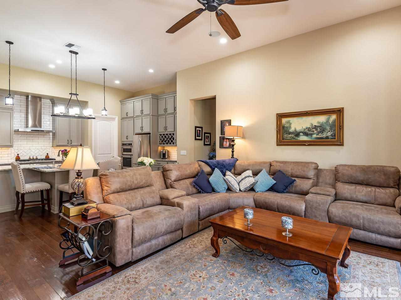 9455 Baldacci Road Reno, NV 89521 - Photo 11 of 22 a living room with furniture kitchen view and a wooden floor