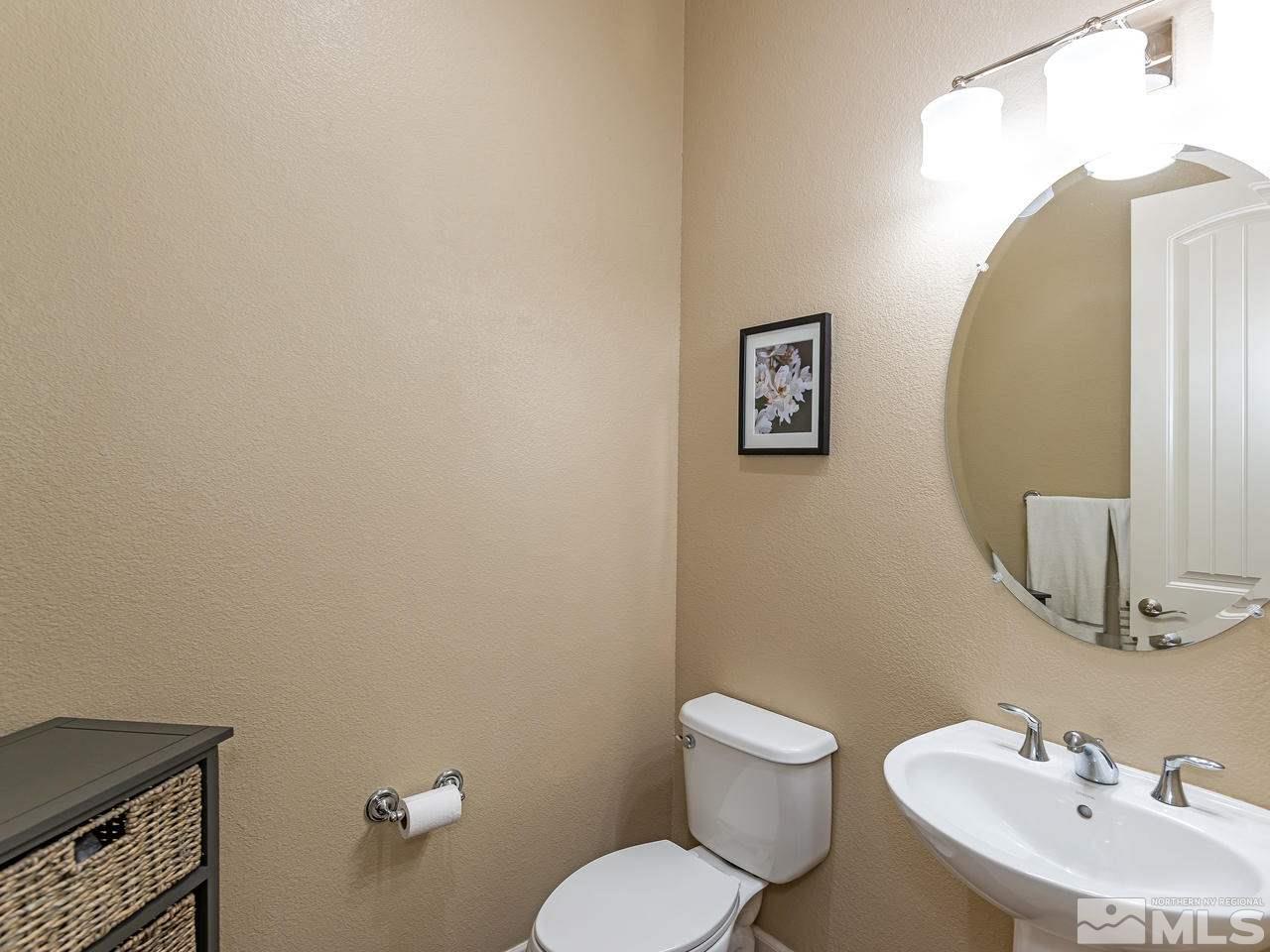 9455 Baldacci Road Reno, NV 89521 - Photo 13 of 22 a bathroom with a toilet sink and mirror