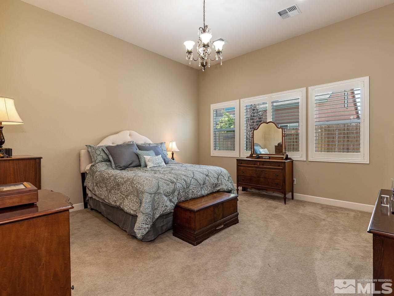 9455 Baldacci Road Reno, NV 89521 - Photo 14 of 22 a bedroom with a bed dresser and a window