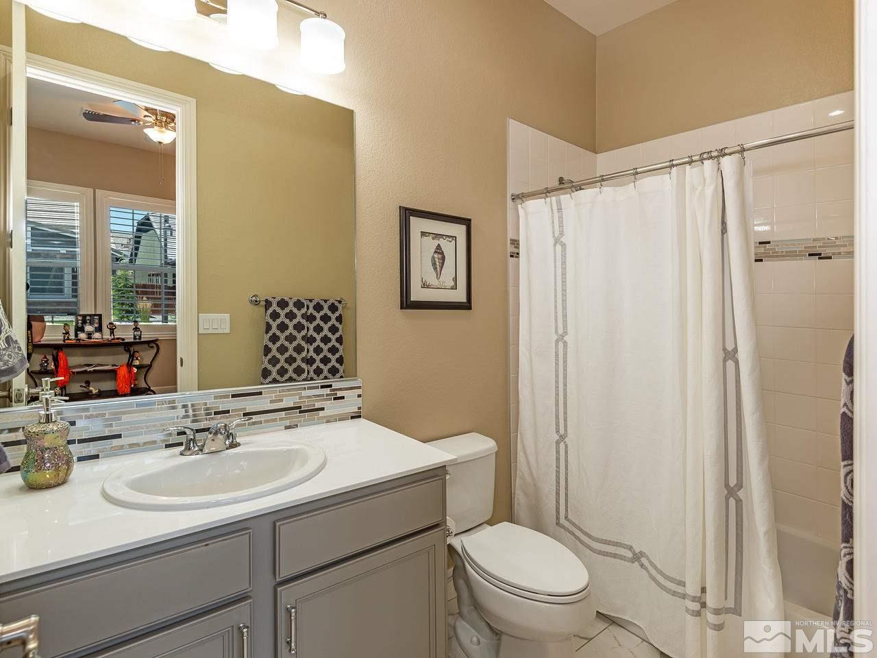 9455 Baldacci Road Reno, NV 89521 - Photo 19 of 22 a bathroom with a sink toilet and shower