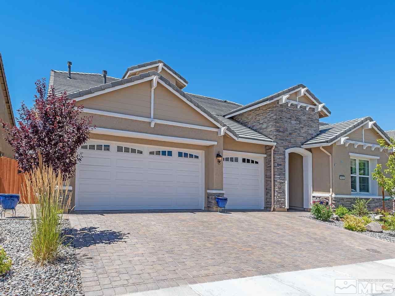9455 Baldacci Road Reno, NV 89521 - Photo 2 of 22 a front view of a house with a yard and garage