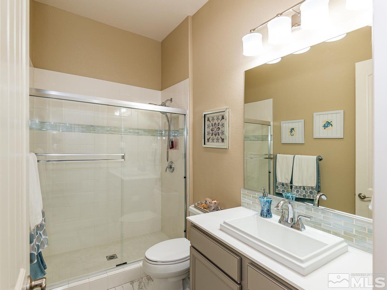 9455 Baldacci Road Reno, NV 89521 - Photo 21 of 22 a bathroom with a sink a toilet and shower