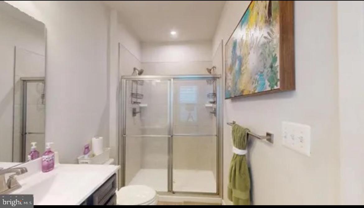 8002 General Greene Street Brandywine, MD 20613 - Photo 11 of 16 a bathroom with a sink toilet and shower