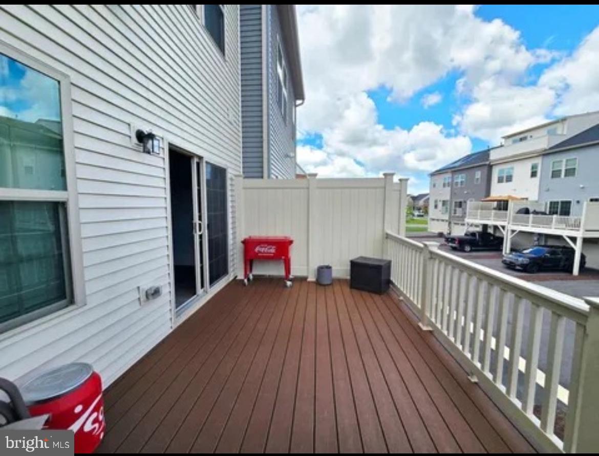 8002 General Greene Street Brandywine, MD 20613 - Photo 15 of 16 a view of a deck with wooden floor and seating space