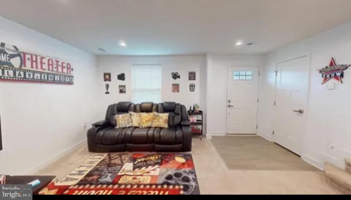 8002 General Greene Street Brandywine, MD 20613 - Photo 2 of 16 a living room with furniture and a rug