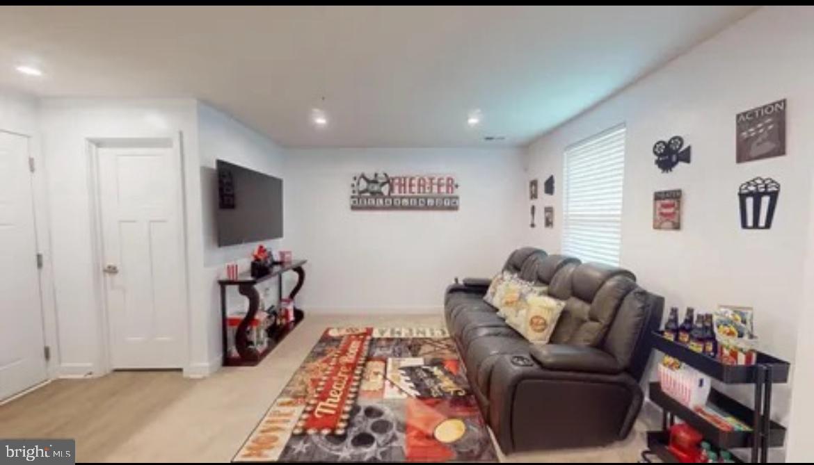 8002 General Greene Street Brandywine, MD 20613 - Photo 3 of 16 a living room with furniture and a flat screen tv