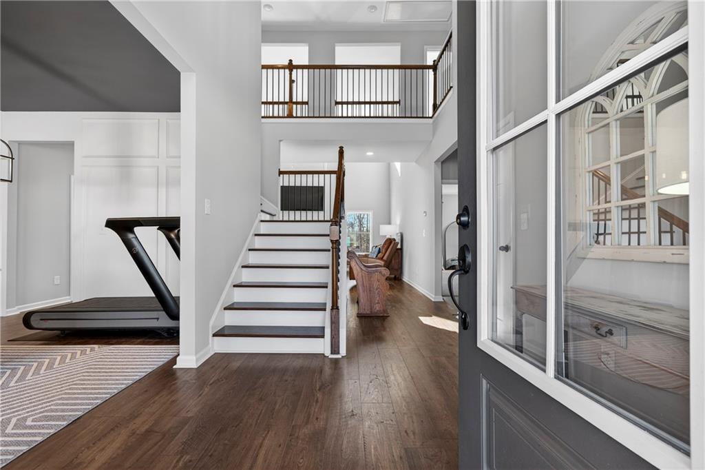 103 Hammond Road Griffin, GA 30223 - Photo 20 of 76 a view of a hallway with wooden floor and staircase