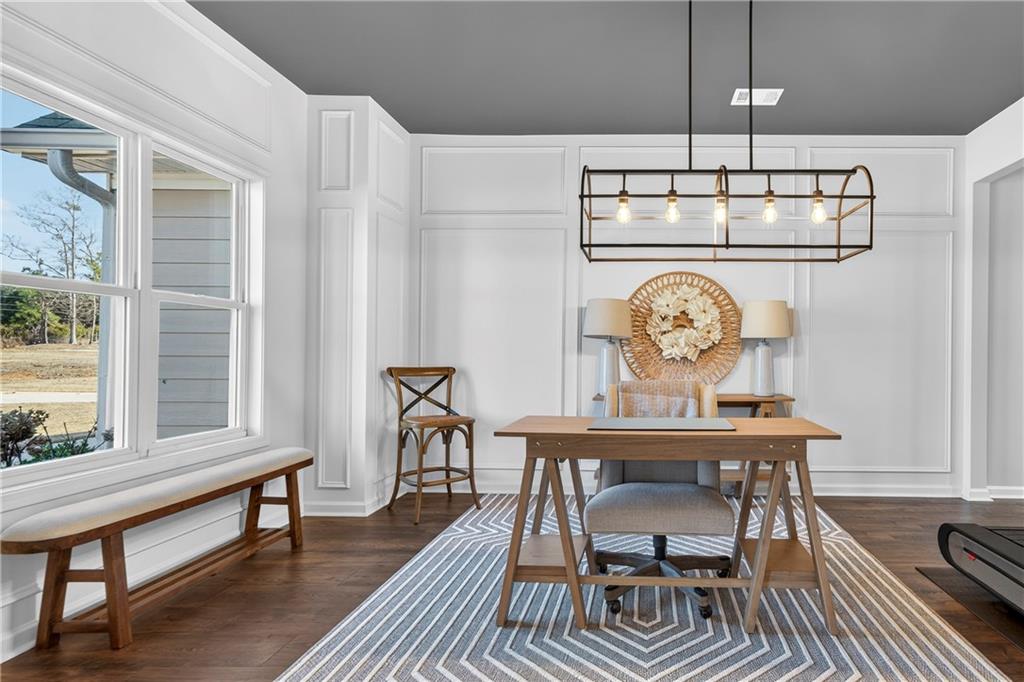 103 Hammond Road Griffin, GA 30223 - Photo 23 of 76 a view of a dining room with furniture a chandelier and wooden floor