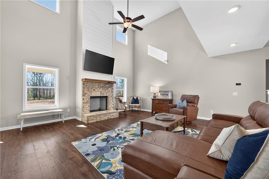 103 Hammond Road Griffin, GA 30223 - Photo 33 of 76 a living room with furniture a fireplace and a flat screen tv