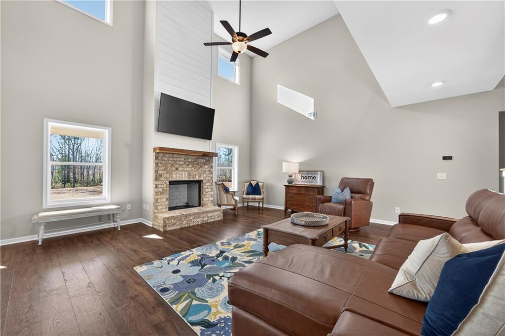 103 Hammond Road Griffin, GA 30223 - Photo 34 of 76 a living room with furniture a fireplace and a flat screen tv