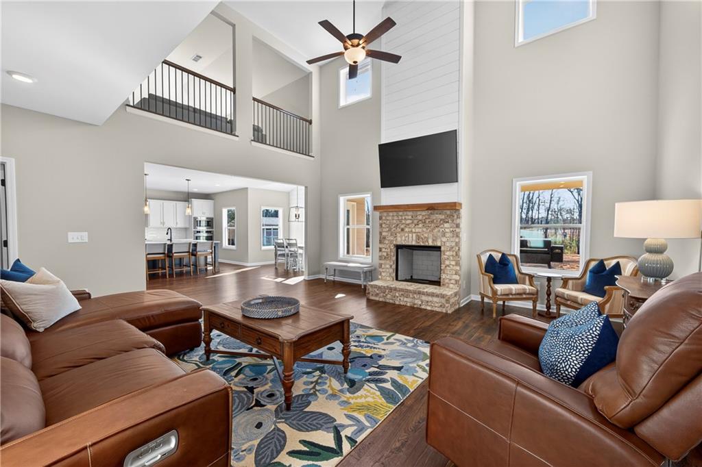 103 Hammond Road Griffin, GA 30223 - Photo 36 of 76 a living room with furniture a flat screen tv and a fireplace