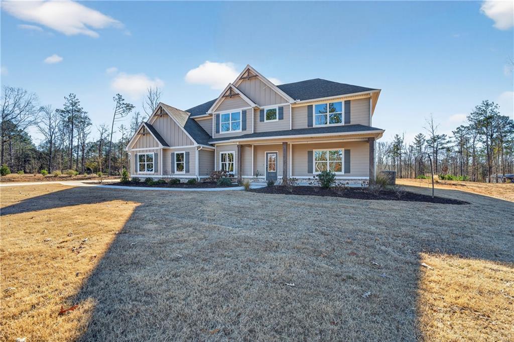 103 Hammond Road Griffin, GA 30223 - Photo 4 of 76 a front view of a house with a yard and trees