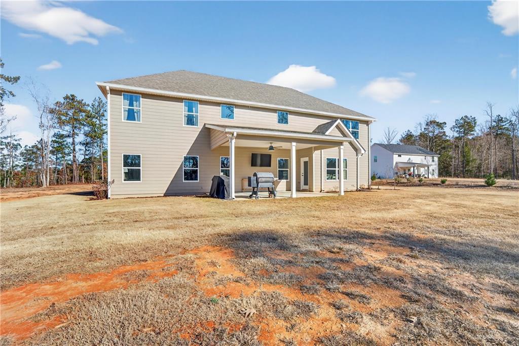103 Hammond Road Griffin, GA 30223 - Photo 5 of 76 a view of a white house with a swimming pool