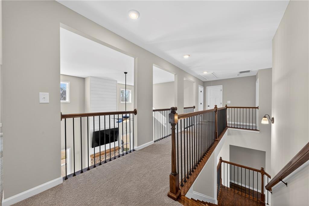 103 Hammond Road Griffin, GA 30223 - Photo 53 of 76 a view of a hallway with wooden floor and entryway