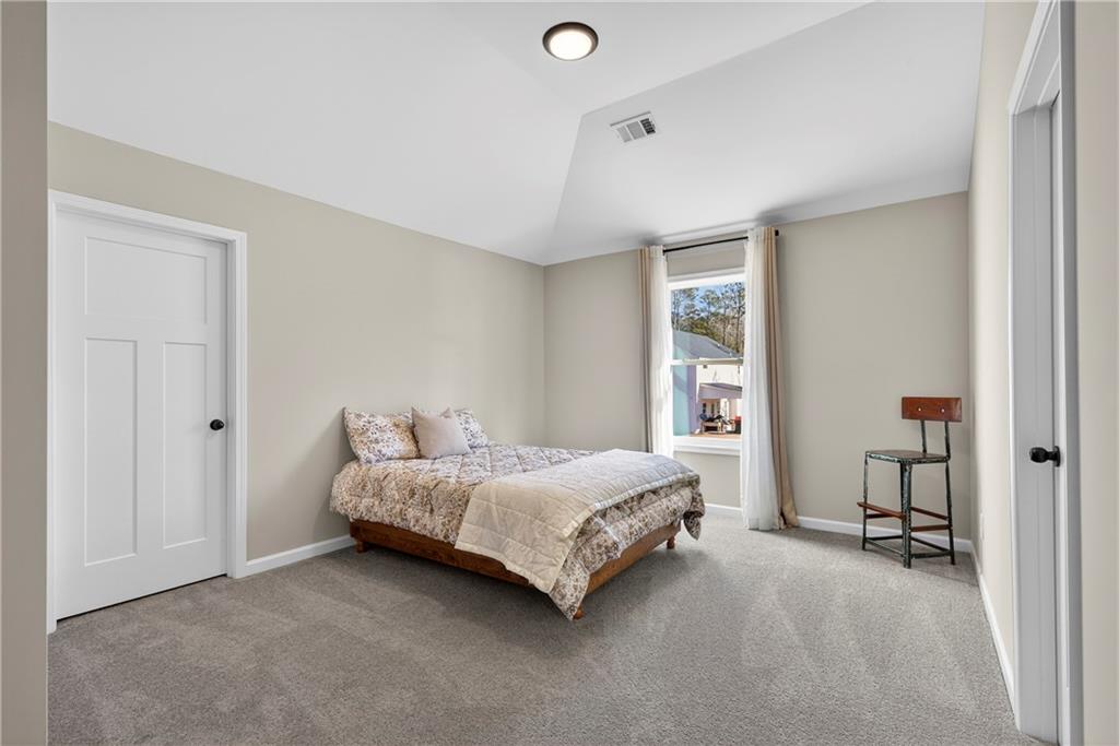 103 Hammond Road Griffin, GA 30223 - Photo 66 of 76 a room with a bed and a table in it