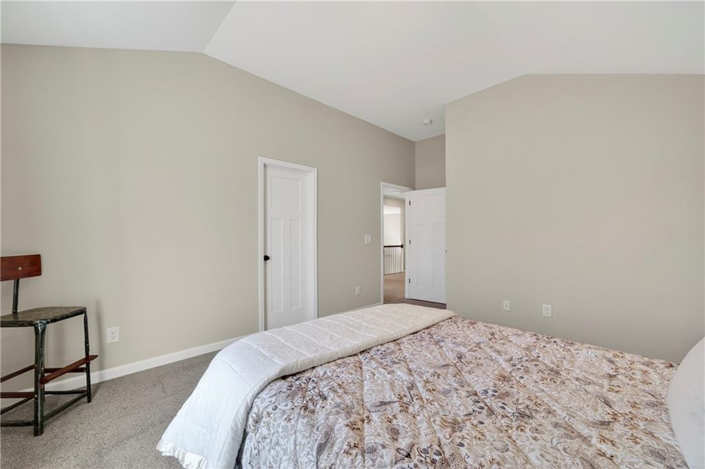 103 Hammond Road Griffin, GA 30223 - Photo 67 of 76 a bedroom with a bed and a table