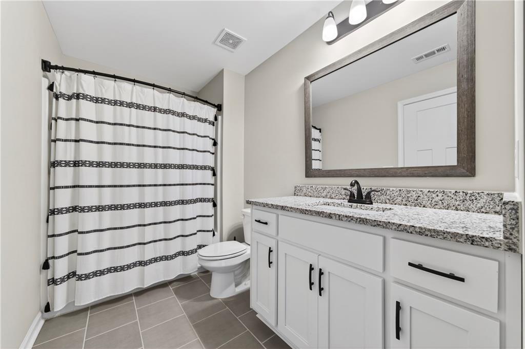 103 Hammond Road Griffin, GA 30223 - Photo 69 of 76 a bathroom with a sink toilet and shower