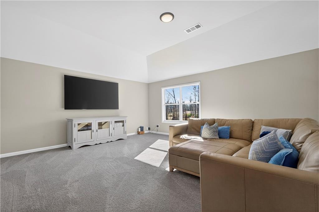 103 Hammond Road Griffin, GA 30223 - Photo 70 of 76 a living room with furniture and a flat screen tv