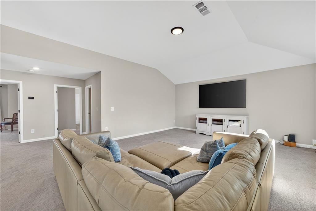 103 Hammond Road Griffin, GA 30223 - Photo 73 of 76 a living room with furniture and a flat screen tv