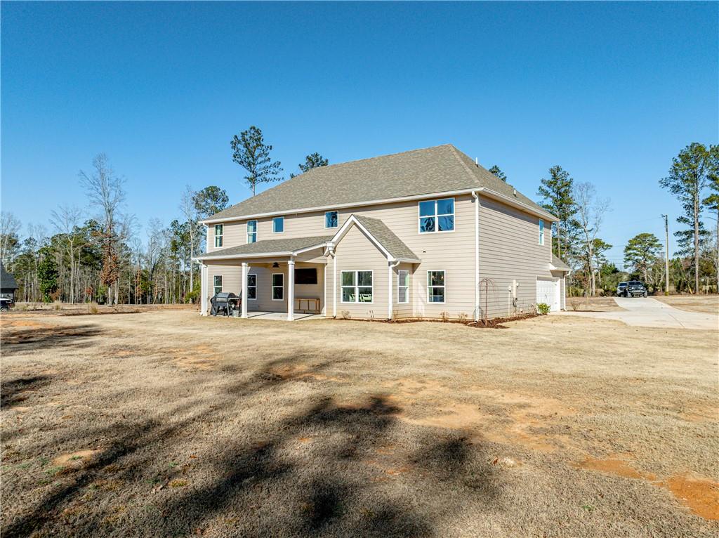 103 Hammond Road Griffin, GA 30223 - Photo 10 of 76 a view of a white house with a yard