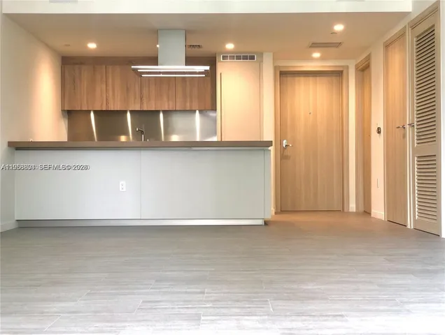 a view of kitchen with wooden floor