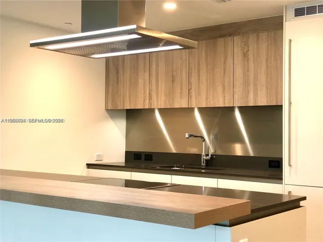 a view of kitchen with wooden floor
