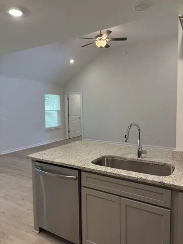 a stove top oven sitting inside of a kitchen