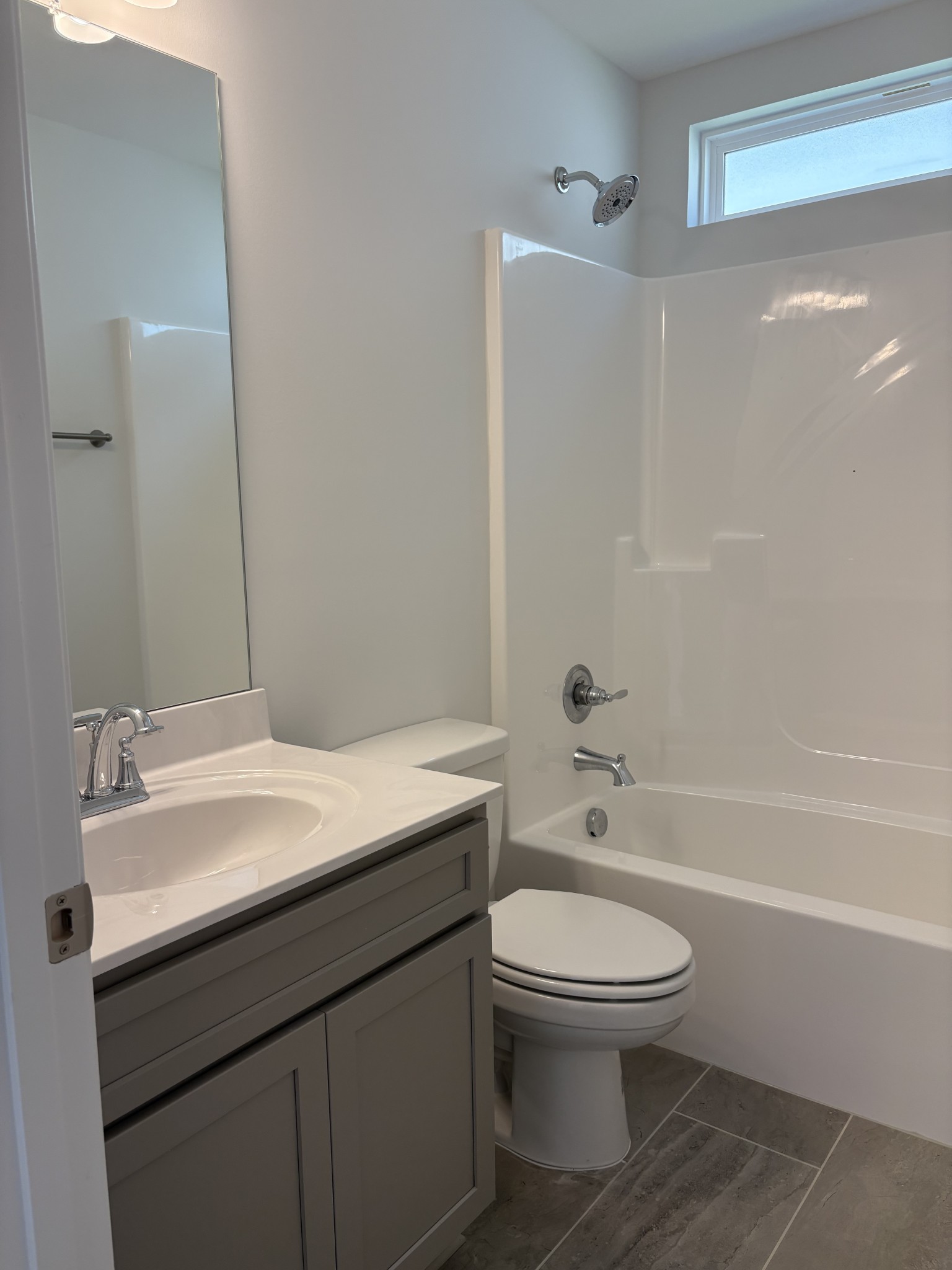 5730 Craven Lane Rockvale, TN 37153 - Photo 9 of 27 a bathroom with a granite countertop toilet a sink and a bathtub