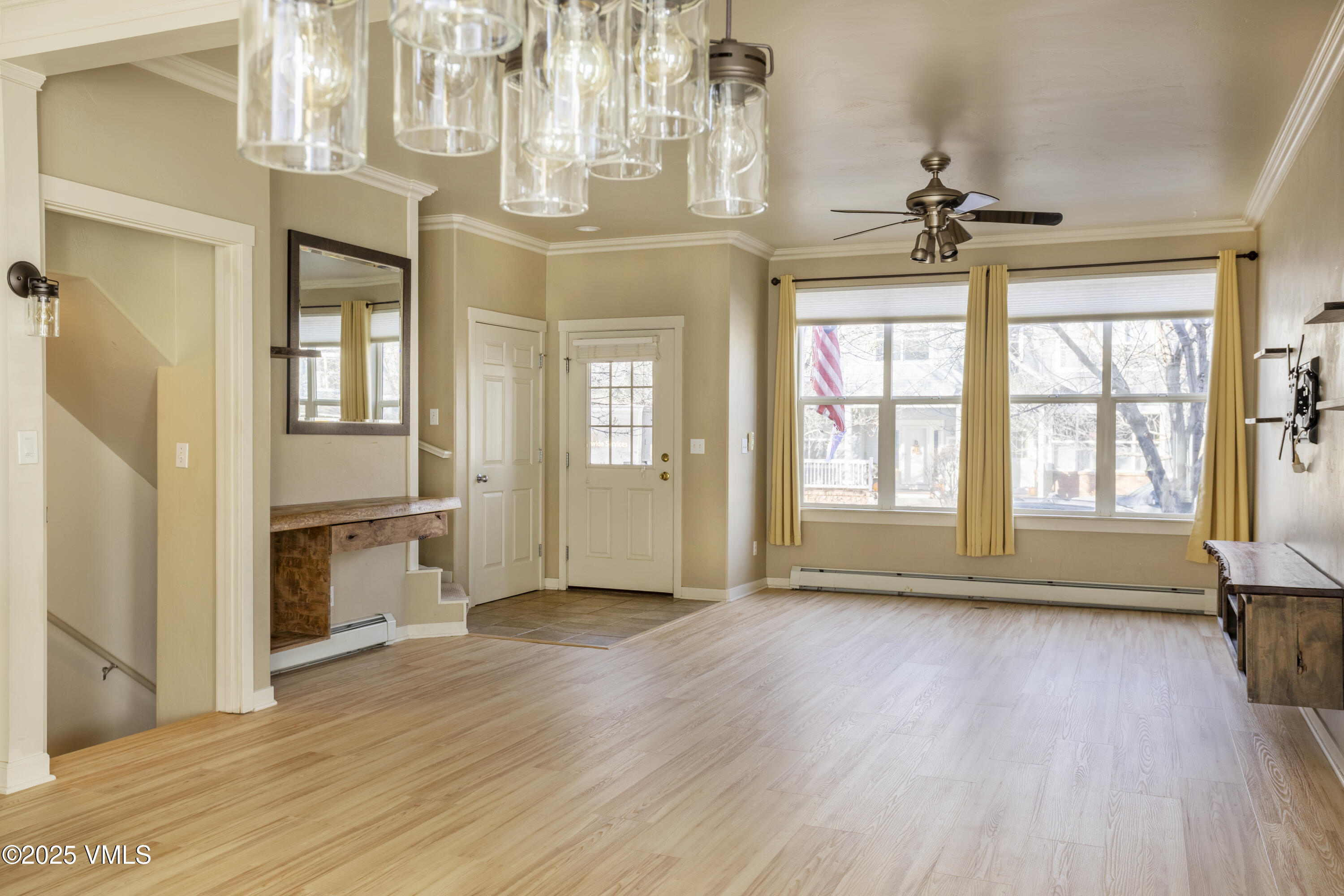 20 MacDonald Street Eagle, CO 81631 - Photo 1 of 10 a view of an empty room with wooden floor and a window