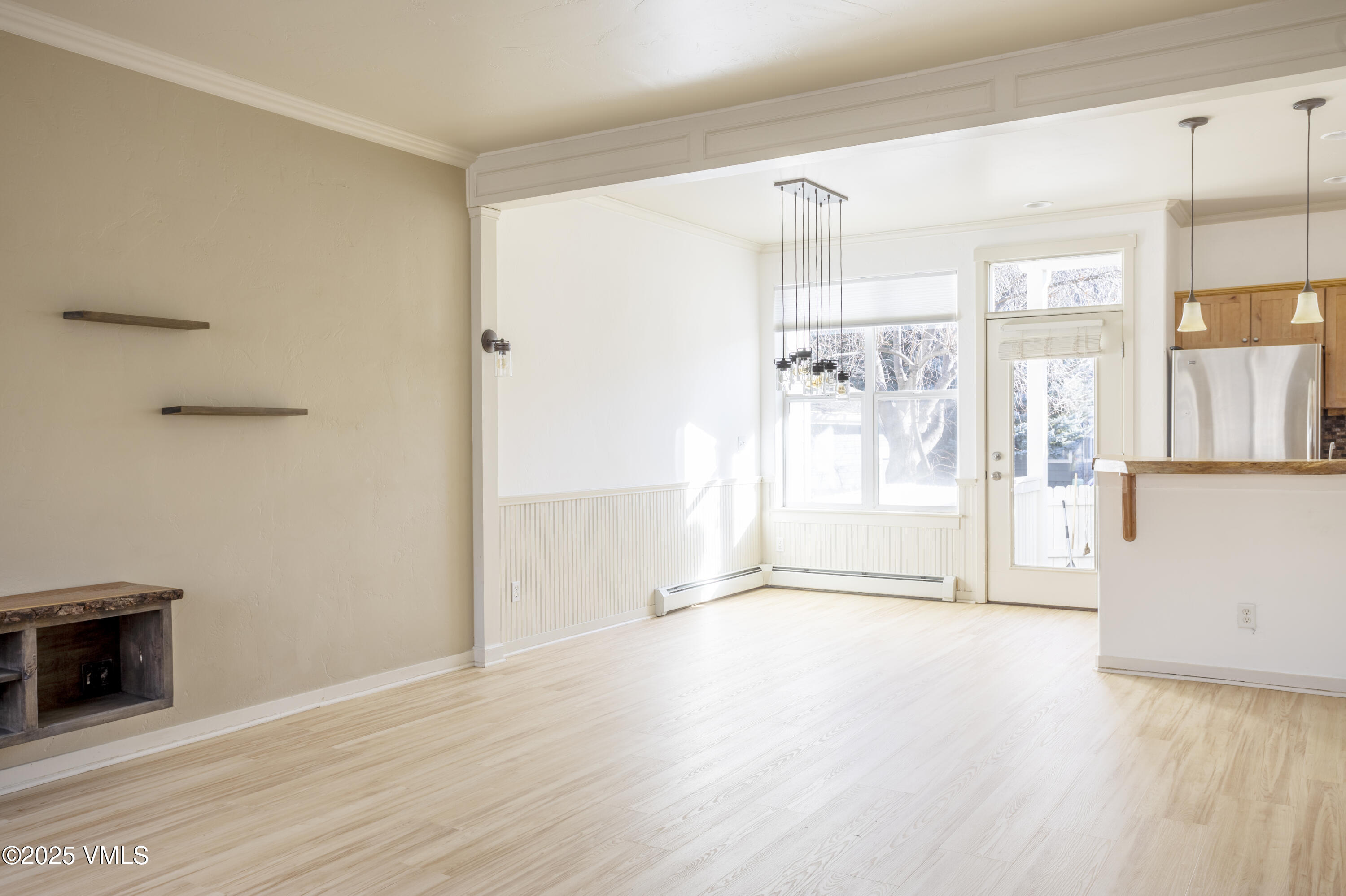20 MacDonald Street Eagle, CO 81631 - Photo 2 of 10 a view of a big room with wooden floor and windows