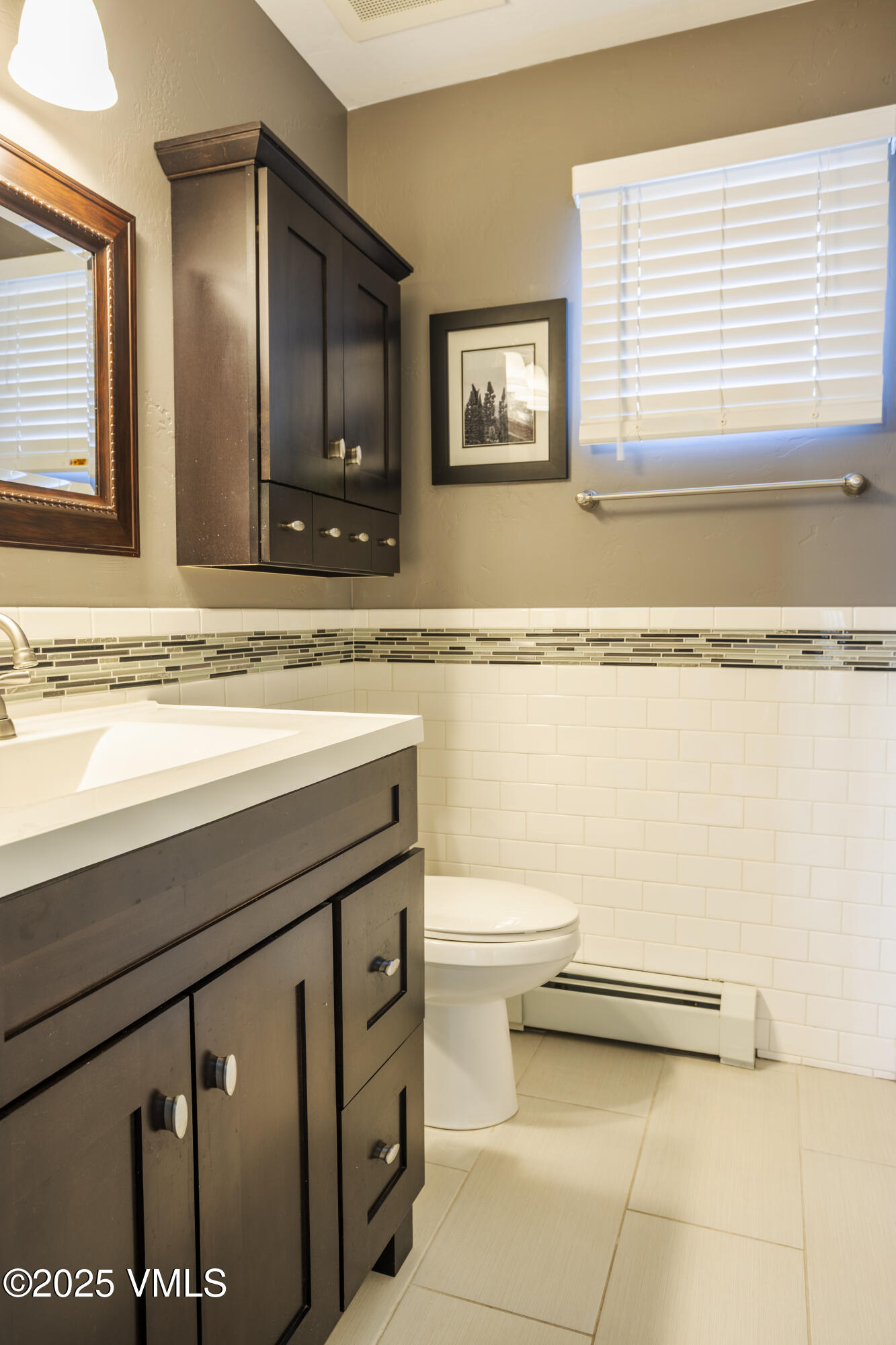 20 MacDonald Street Eagle, CO 81631 - Photo 7 of 10 a bathroom with a sink a toilet and mirror