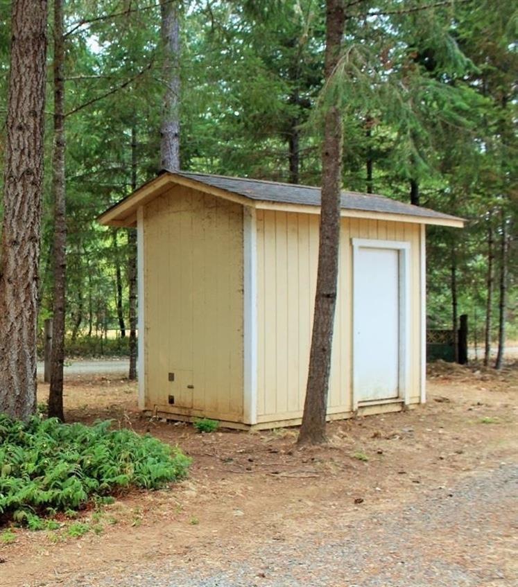 3615 Dick George Road Cave Junction, OR 97523 - Photo 21 of 24 Pump house and 2000 gallon holding tank.