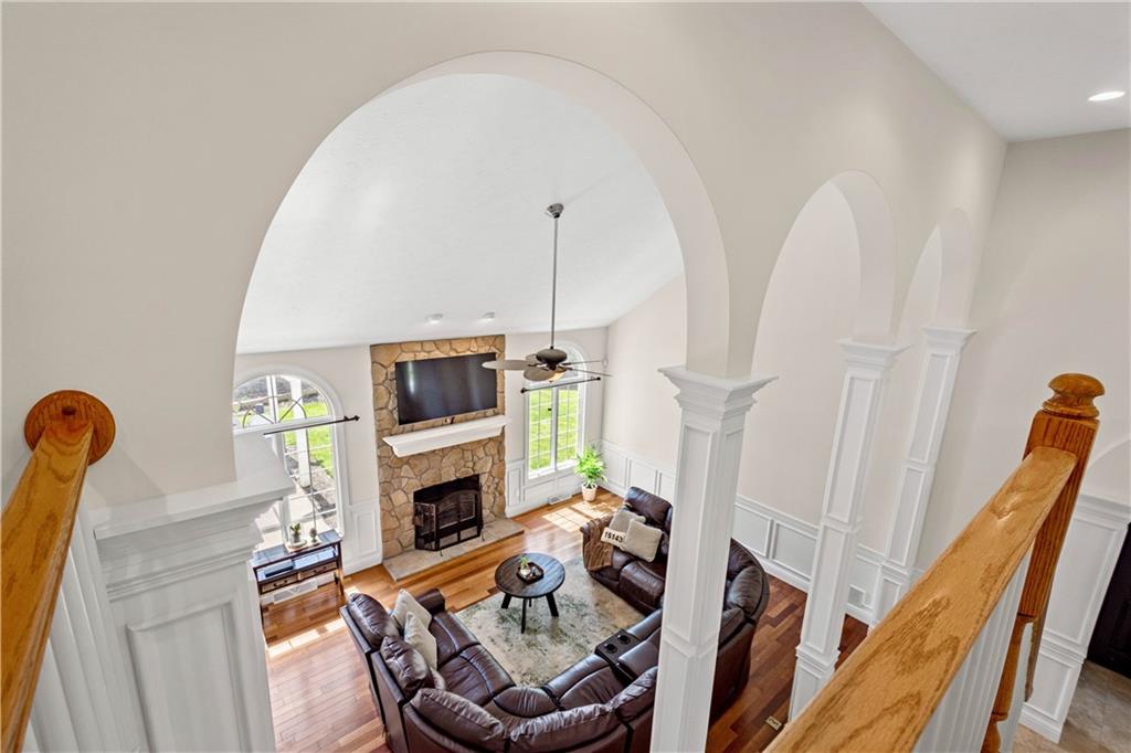 352 Water Works Road Sewickley, PA 15143 - Photo 12 of 49 a living room with furniture a fireplace and a flat screen tv