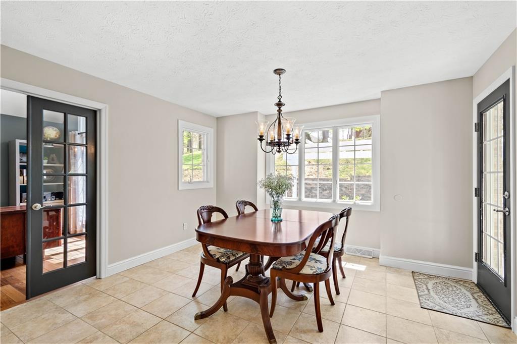 352 Water Works Road Sewickley, PA 15143 - Photo 17 of 49 a view of a dining room with furniture window and outside view