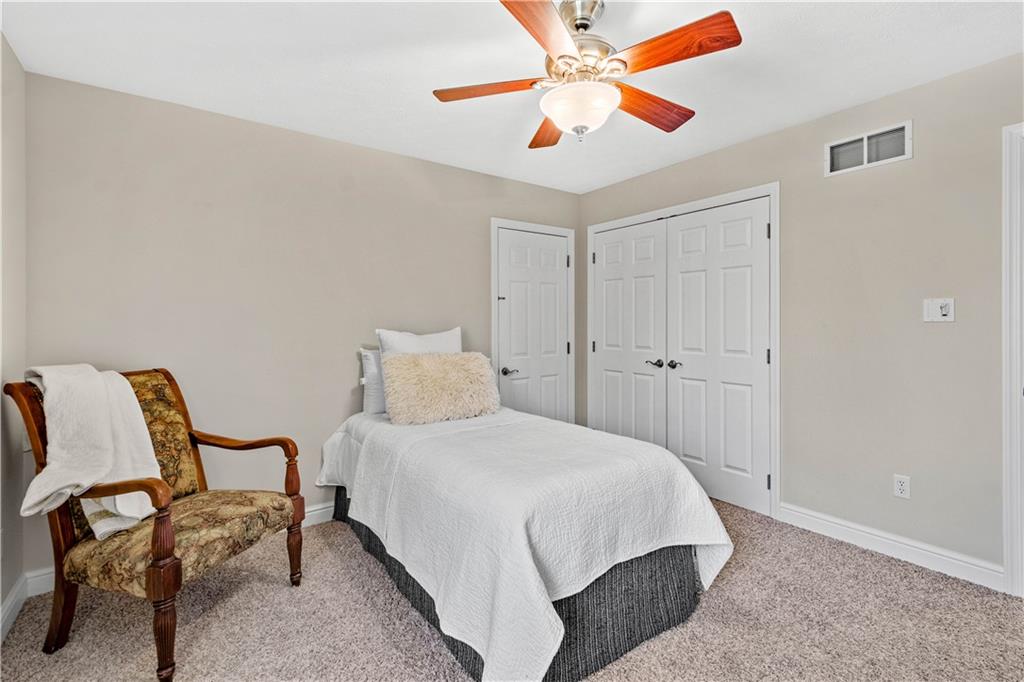 352 Water Works Road Sewickley, PA 15143 - Photo 30 of 49 a bedroom with a bed and a chandelier