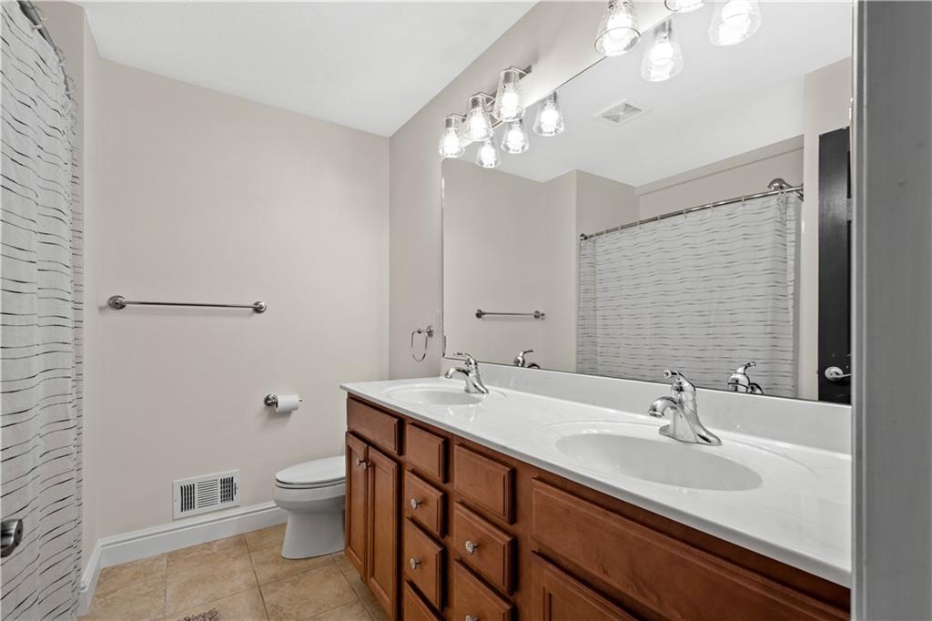 352 Water Works Road Sewickley, PA 15143 - Photo 31 of 49 a bathroom with a sink a toilet and a mirror