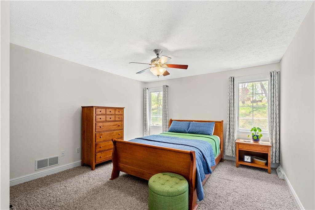 352 Water Works Road Sewickley, PA 15143 - Photo 32 of 49 a bedroom with a bed and a chandelier