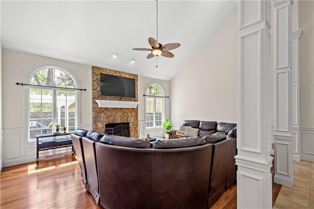 352 Water Works Road Sewickley, PA 15143 - Photo 10 of 49 a living room with furniture a fireplace and a flat screen tv