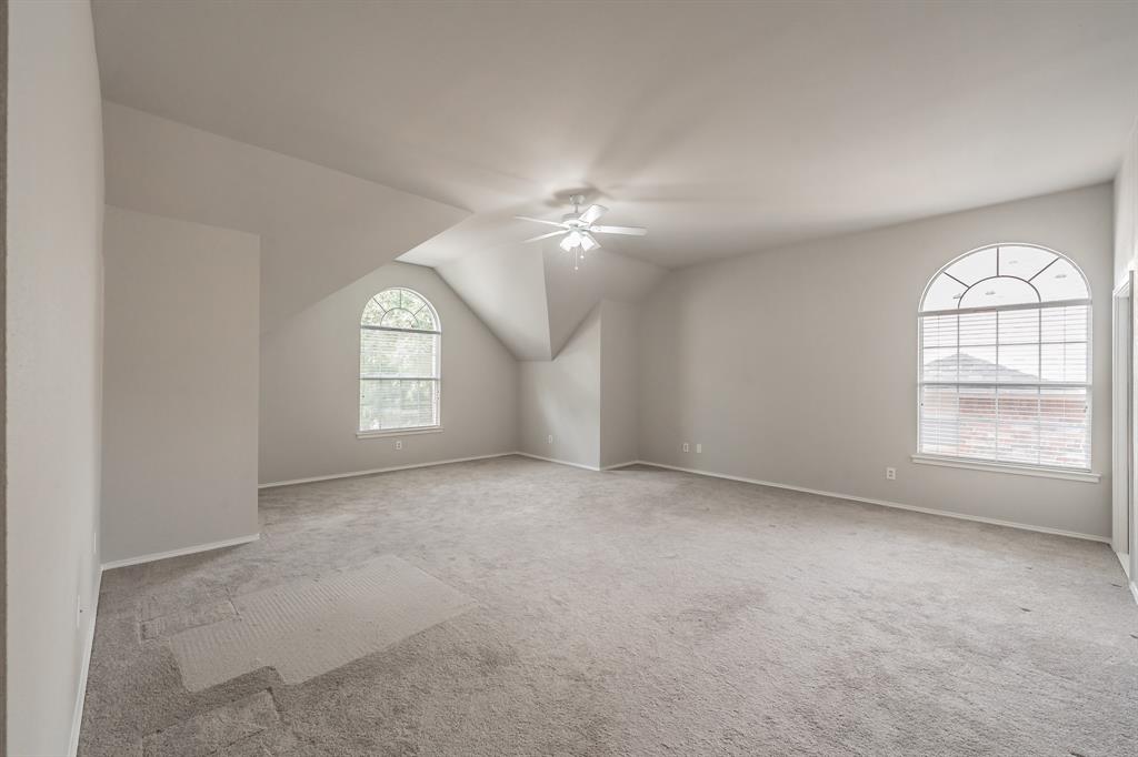 1803 Haydenbend Circle Grapevine, TX 76051 - Photo 22 of 40 Primary bedroom with windows offering lots of natural light.